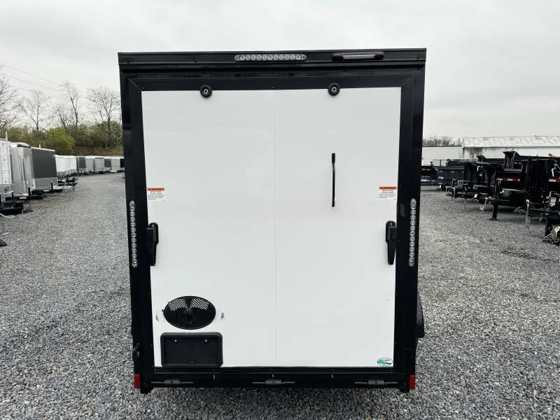 2024 Cargo Mate 5.5x10' Enclosed Toy Hauler Trailer 2990# GVW * TOY HAULER * FOLD OUT BED * WHITE BLACKOUT * SLANT V-NOSE * ALUMINUM WHEELS * .030 SCREWLESS EXTERIOR * REAR SPOILER * PLYWOOD FLOORS/WALLS * TABLE * MAX AIR COVER * EXTRA HEIGHT - Image 7